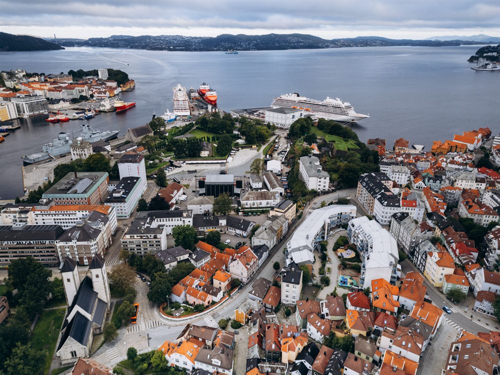 Aerial view of a harbor town with cruise ships at the piers