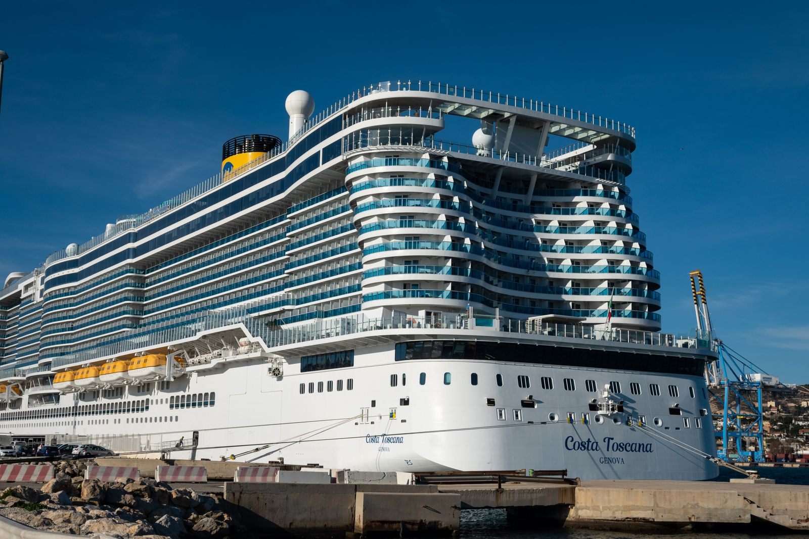 Bow of a large cruise ship moored at a pier